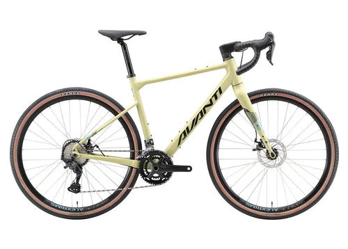 Avanti gravel bicycle in a pale yellow frame with black components, drop handlebars, and black tires with tan sidewalls, shown against a plain white background.
